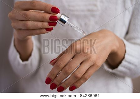 Hands To Apply The Serum