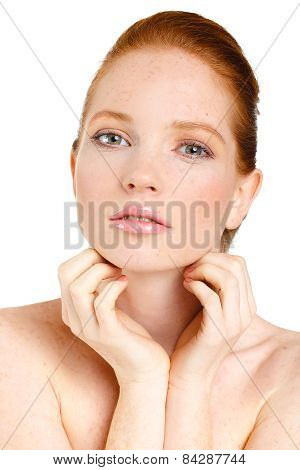 Beautiful young redhead woman with freckles portrait isolated on white