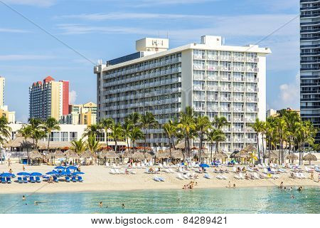 People Relax Near The Pier In Sunny Isles Beach