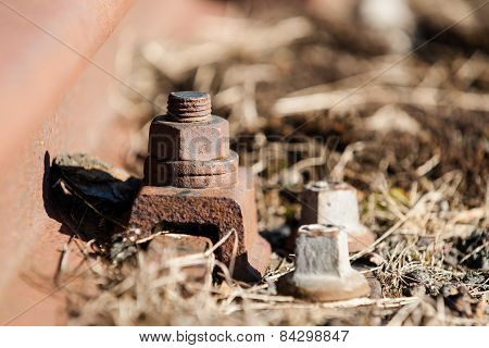 Old And Lost Railroadtrack With Nut And Bolt