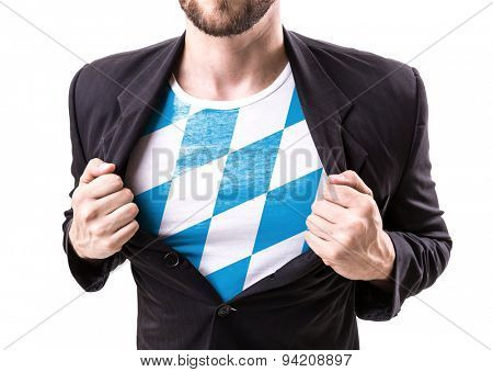 Businessman stretching suit with Bavarian Flag on white background
