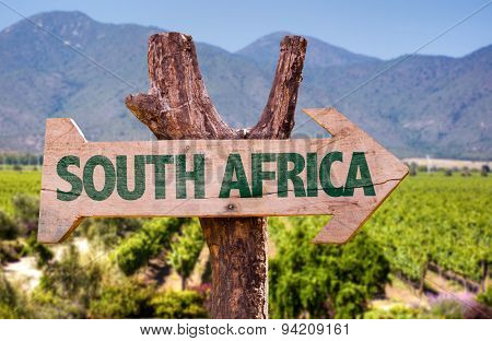 South Africa wooden sign with vineyard background