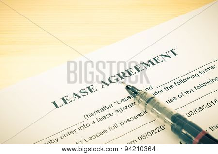 Lease Agreement Contract Document And Pen At Bottom Right Corner Vintage Style
