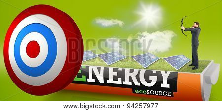 Businessman shooting a bow and arrow against solar panels in a sunny field in an energy saving battery