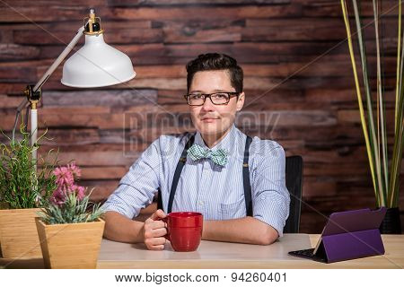 Confident Female In Bowtie With Mug