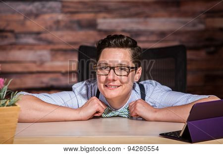 Happy Boyish Boss At Desk