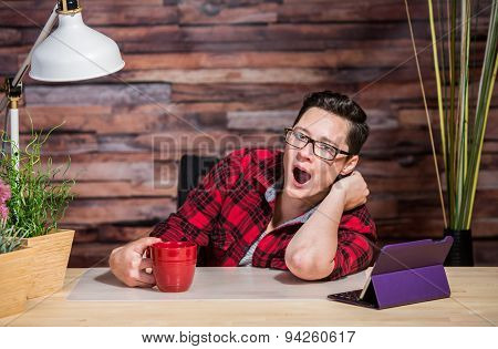 Yawning Woman At Desk