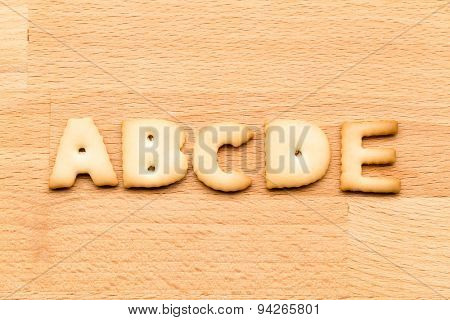 Letter ABCDE cookie over the wooden background