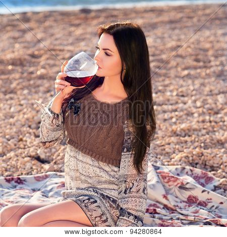 Young Woman Holding Glass Of Red Italian Wine. Sunset