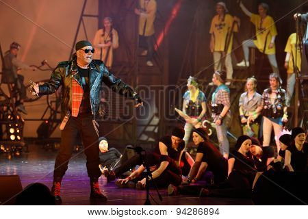 ST. PETERSBURG, RUSSIA - JUNE 19, 2015: Singer Alexey Kortnev performs in a scene from a children's charity project titled Mowgli Generation. The performance is part of the SPIEF 2015