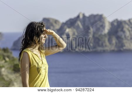 Woman Looking With The Hand In Forehead And The Sea In The Background.