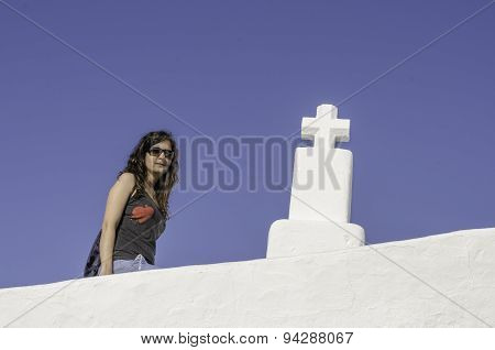 Girl And Cross With Blue Background.