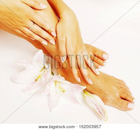 manicure pedicure with flower lily close up isolated on white perfect shape hands spa salon, mani pedi concept