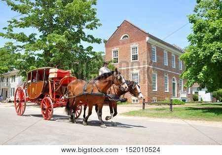 WILLIAMSBURG, VA, USA - MAY 7, 2012: Horse drawn carriage tours in British Colony in Williamsburg, Virginia, USA.