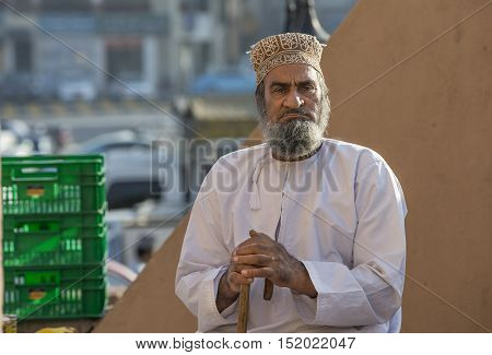 Nizwa Oman October 13th 2016: Old omani man in a goat market