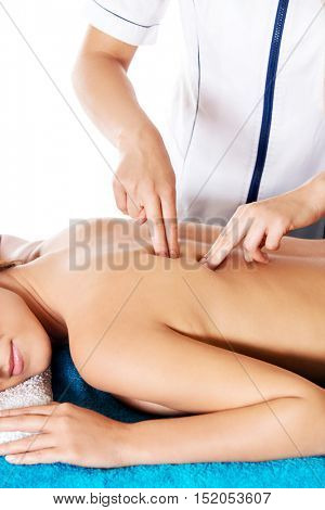 Woman having massage of body in the spa salon. Beauty treatment concept.