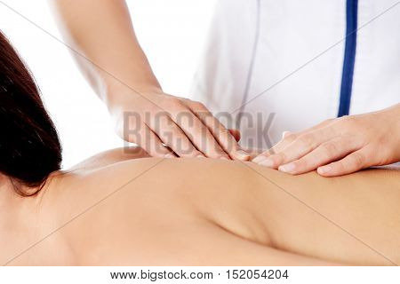 Woman having massage of body in the spa salon. Beauty treatment concept.