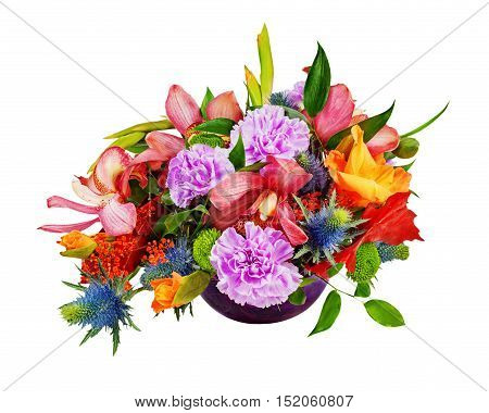Floral bouquet of orchids, gladioluses and carnations arrangement centerpiece in blue glass vase isolated on white background