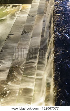 Long exposure of cascading fountain in tidal well along Harborwalk in South Boston