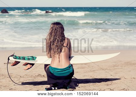 surfergirl is wating for the perfect wave