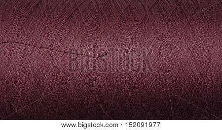 Background texture of industrial, purple silk thread.
