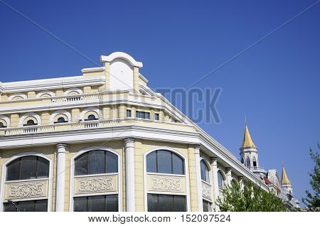 The exterior of a building on Zhongyang street in harbin China located in Heilongjiang province on a sunny blue sky day.