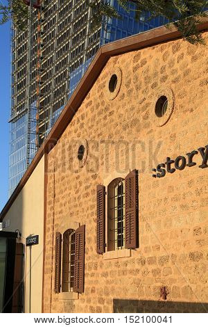 TEL AVIV, ISRAEL - APRIL 7, 2016: View of open air commercial center Sarona and skyscrapers, Tel Aviv, Israel. Open Sarona Market became most popular place in Tel Aviv. Sunset light