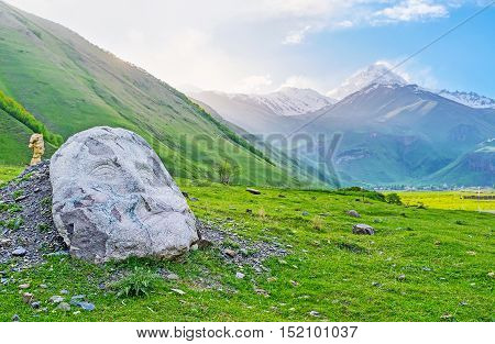 The stone heads of famous Georgians are the notable landmark of Sno village in Kazbegi Georgia.