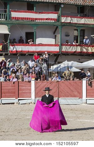 Chinchon SPAIN - October 15 2016: Spanish bullfighter Miguel Abellan with the cape in the main square of chinchon during the festival benefit traditional Chinchon Madrid province Spain