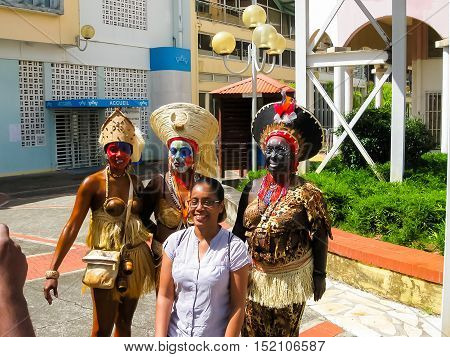 Point-a-Pitre, Guadeloupe - February 09, 2013: Beautiful black girls making a photo and preparing at the Caribbean Carnival at Point-a-Pitre, Guadeloupe