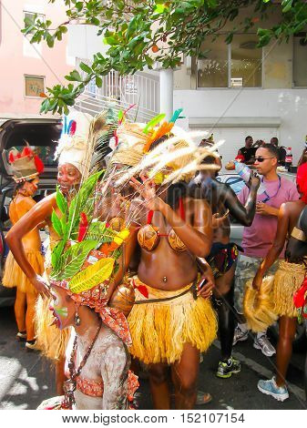 Point-a-Pitre, Guadeloupe - February 09, 2013: Beautiful black girls making a photo and preparing at the Caribbean Carnival at Point-a-Pitre, Guadeloupe