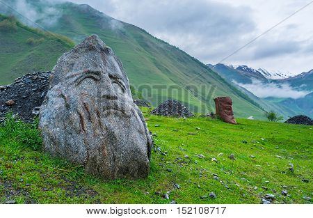 The small village of Sno is famous for its medieval and modern landmarks the large stone heads of famous Georgians (writers and poets) stand on the green meadow Georgia.