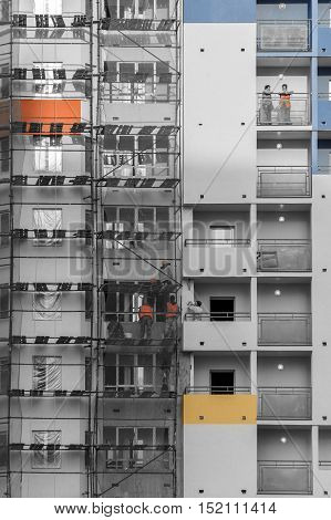 Finishing construction. Facade work on the building.