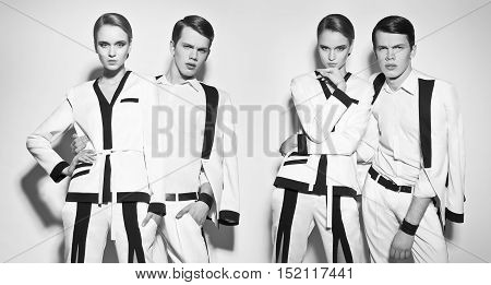 Fashion couple in white suite on the white background