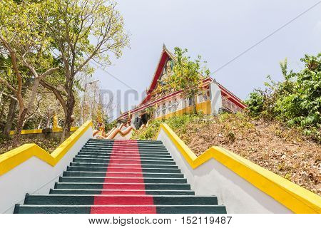 Phuket Thailand - April 25 2016 : The main stair leading to the replica of Phra That In-Kwaen (Hanging Golden Rock) at Sirey temple Phuket Thailand.