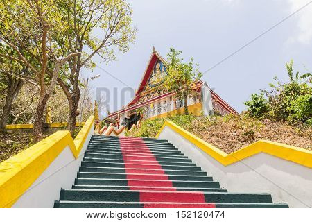 Phuket Thailand - April 25 2016 : The main stair leading to the replica of Phra That In-Kwaen (Hanging Golden Rock) at Sirey temple Phuket Thailand.
