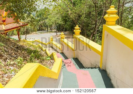 Phuket Thailand - April 25 2016 : Yellow stair wall at Sirey temple Phuket Thailand. It is old Burmese art.