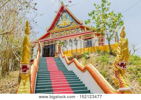 Phuket Thailand - April 25 2016 : The main stair leading to the replica of Phra That In-Kwaen (Hanging Golden Rock) at Sirey temple Phuket Thailand.