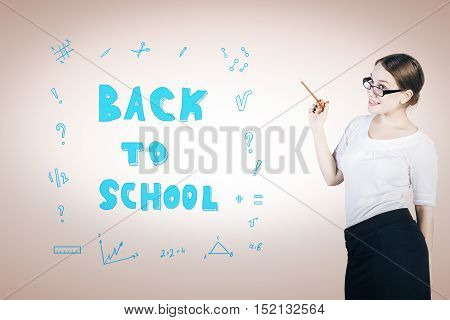 Pretty young woman teahcer with back to school sketch. Education concept