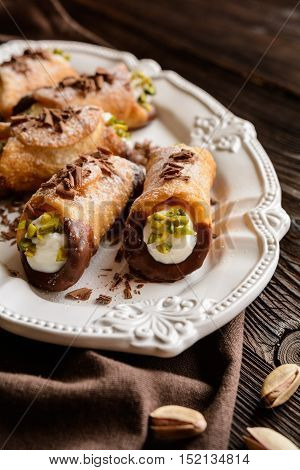 Traditional Sicilian Cannoli Stuffed With Ricotta And Pistachios