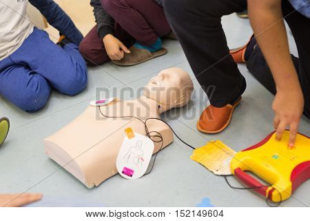 First aid cardiopulmonary resuscitation course using automated external defibrillator device, AED.