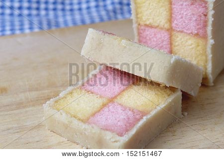 Freshly Cut Battenberg Cake With Pink And Yellow Sponge Covered In Marzipan