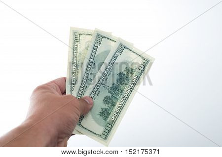 men believes the dollars in hand on white background
