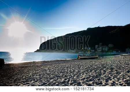 fishermen's arrival on the coast at dawn after a night of fishing with the sun kissing the sea