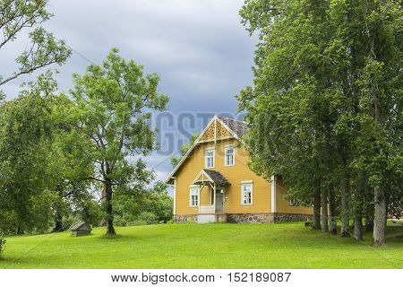 landscape background old wooden house in Turaida castle park, in the vicinity of Riga, Latvia