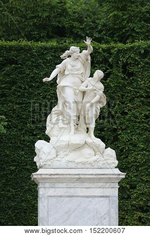 Statue on a path of Versailles garden Paris France
