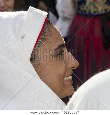 SELARGIUS, ITALY - September 8, 2013: Former marriage Selargino - Sardinia - portrait of a beautiful smiling woman in traditional Sardinian costume