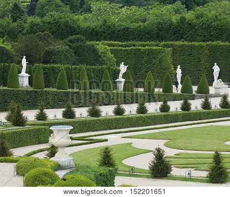 Statue on a path of Versailles garden Paris France