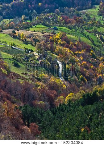 Aerial view of meadows and rolling hills in autumn, Bobija mountain, west Serbia