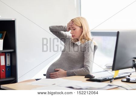 pregnancy, business, stress, gestosis and people concept - pregnant businesswoman feeling sick at office work